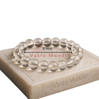 Natural clear quartz crystal bracelet– Vastu remedy presented with a hand for visual scale