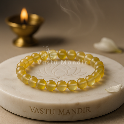 Natural yellow aura quartz crystal bracelet shown with a hand in a lifestyle photograph