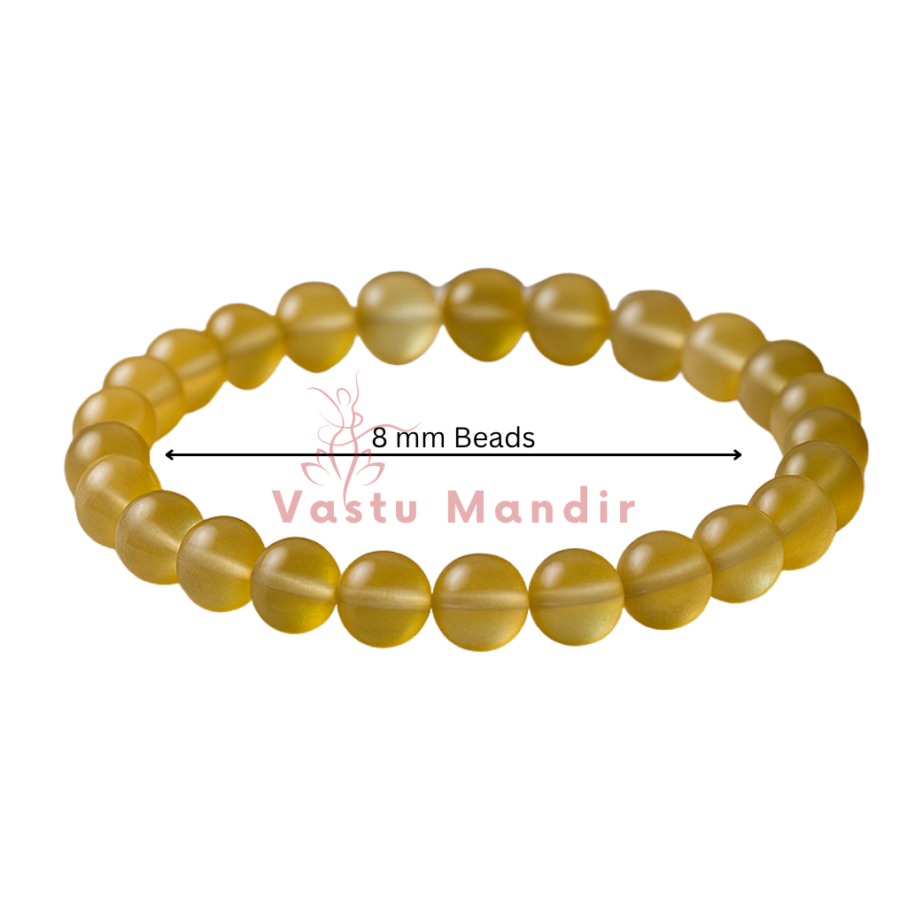 Natural yellow aura quartz crystal bracelet with round beads on a clean white background