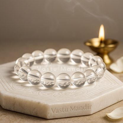 Natural clear quartz crystal bracelet– Vastu remedy shown with a hand in a lifestyle photograph