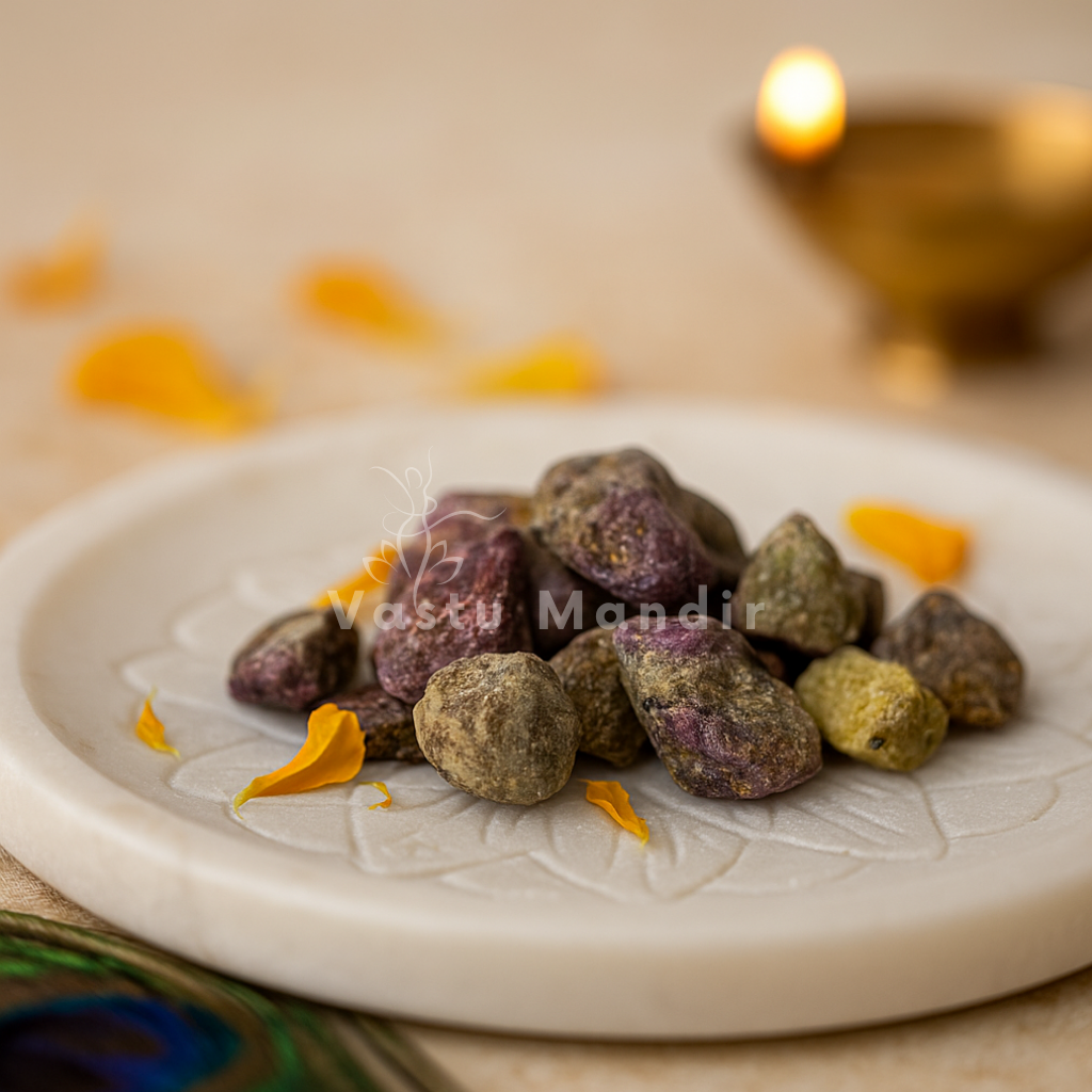 Large rough green and purple gemstone pieces displayed on a decorated white plate