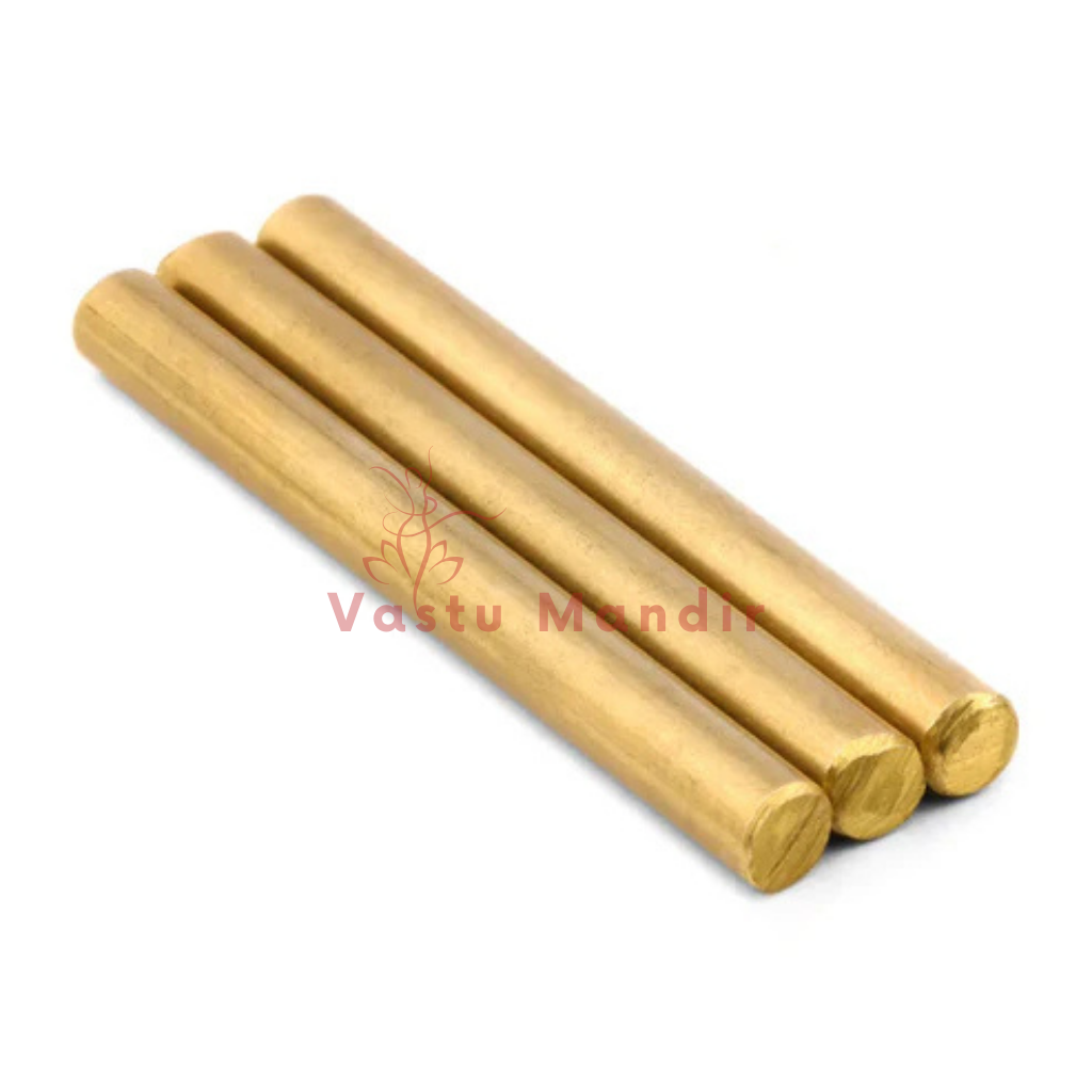 Three brass round studs arranged diagonally on a white background