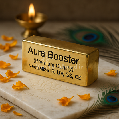 Brass aura booster displayed in a dark, softly lit spiritual setting