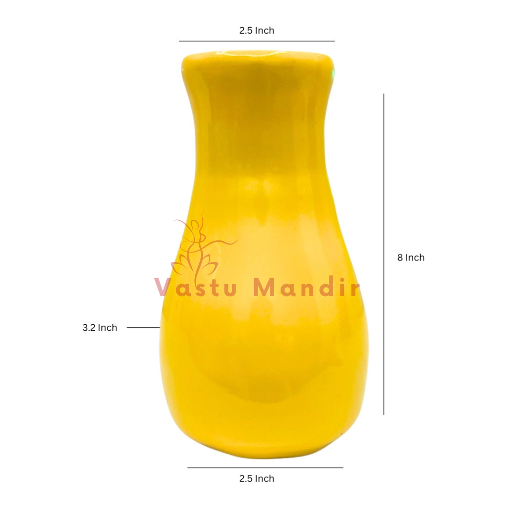 Front view of small yellow resin vase sculpture on a clean background
