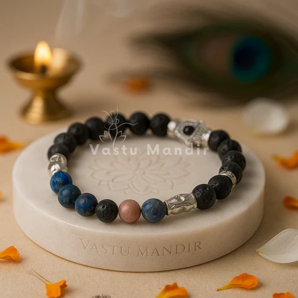 Natural Lava stone with mixed throat-energy crystals (blue/neutral tones) + metal spacers on a 'Vastu Mandir' stand with a blurred background