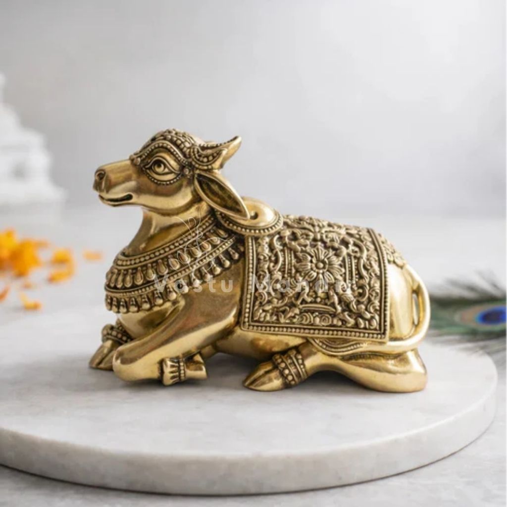 Premium brass Nandi bull idol on a sacred white plate with marigold petals