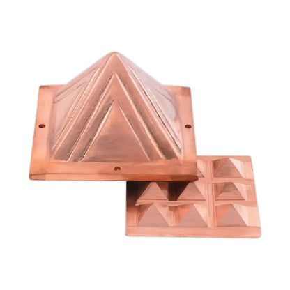 Two-layer copper Vastu pyramid shown with the upper and lower sections offset on a white background