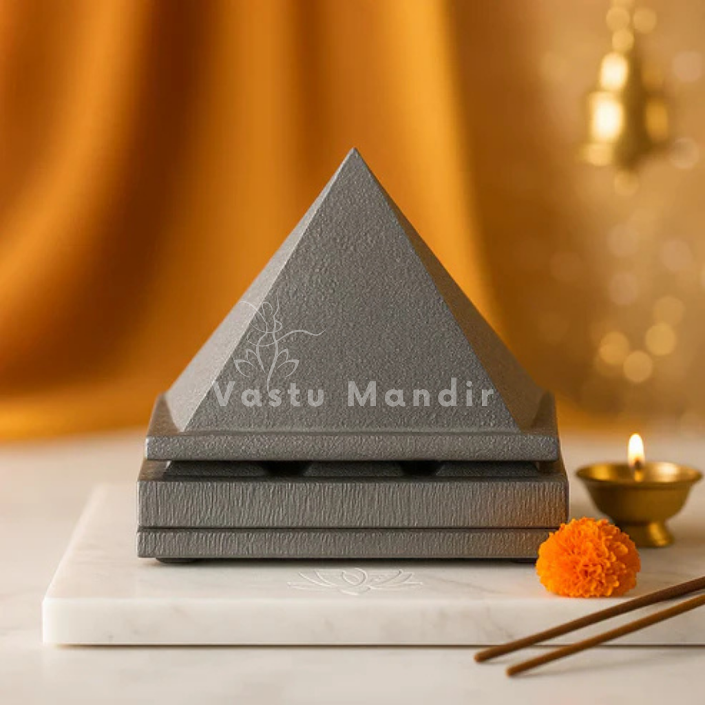 Front view of stacked 3-layer lead pyramid with brass diya and incense sticks