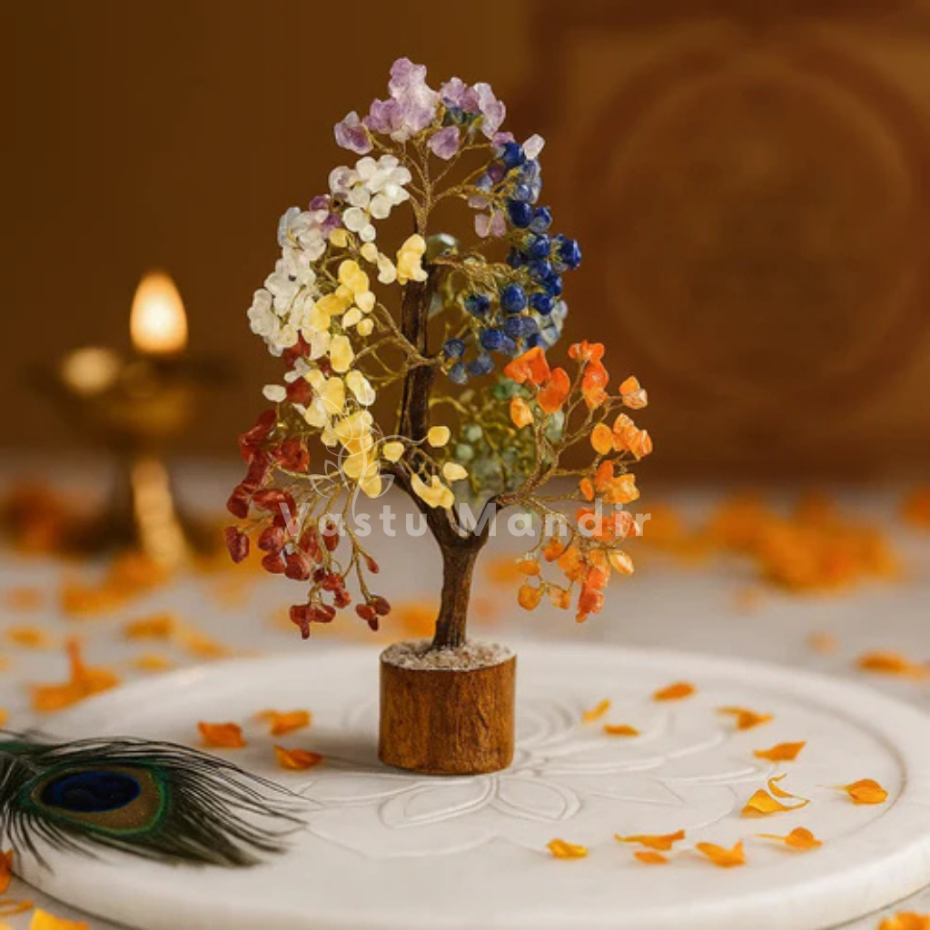 7 chakra crystal tree displayed in a dark, softly lit spiritual setting