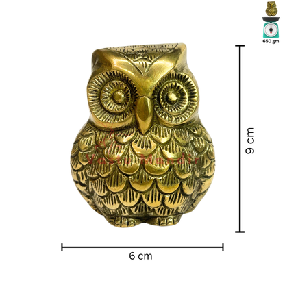 Brass owl idol front view isolated on white background