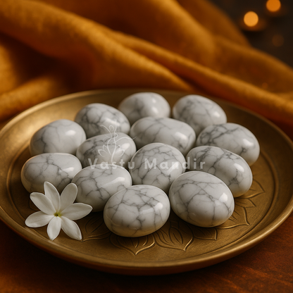 Natural howlite tumbled stones displayed in a dark, softly lit spiritual setting