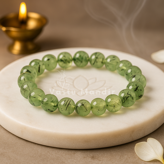 Natural prehnite crystal bracelet shown with a hand in a lifestyle photograph
