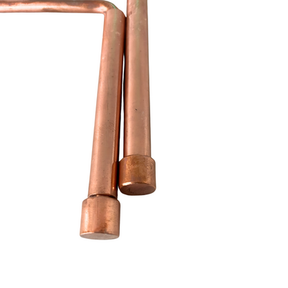 Close-up of cylindrical copper handles and rotating rod joints