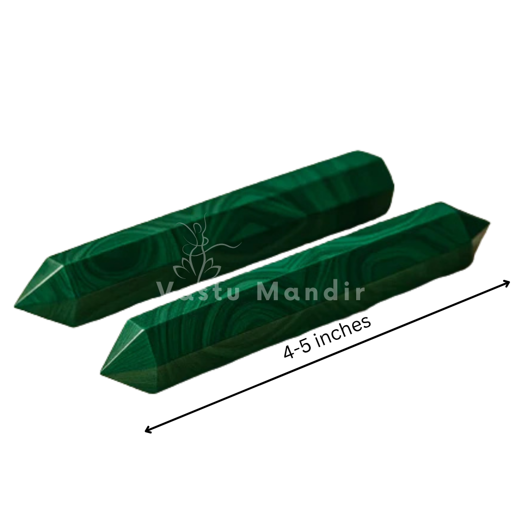 Malachite crystal pencils on white with a horizontal length measurement graphic
