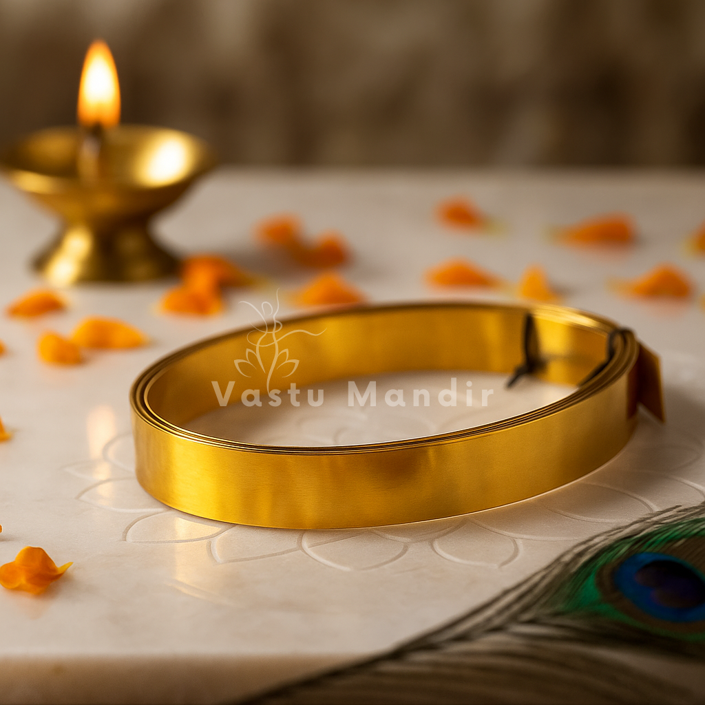 Pure brass Vastu strip coil with marigold petals, diya and peacock feather