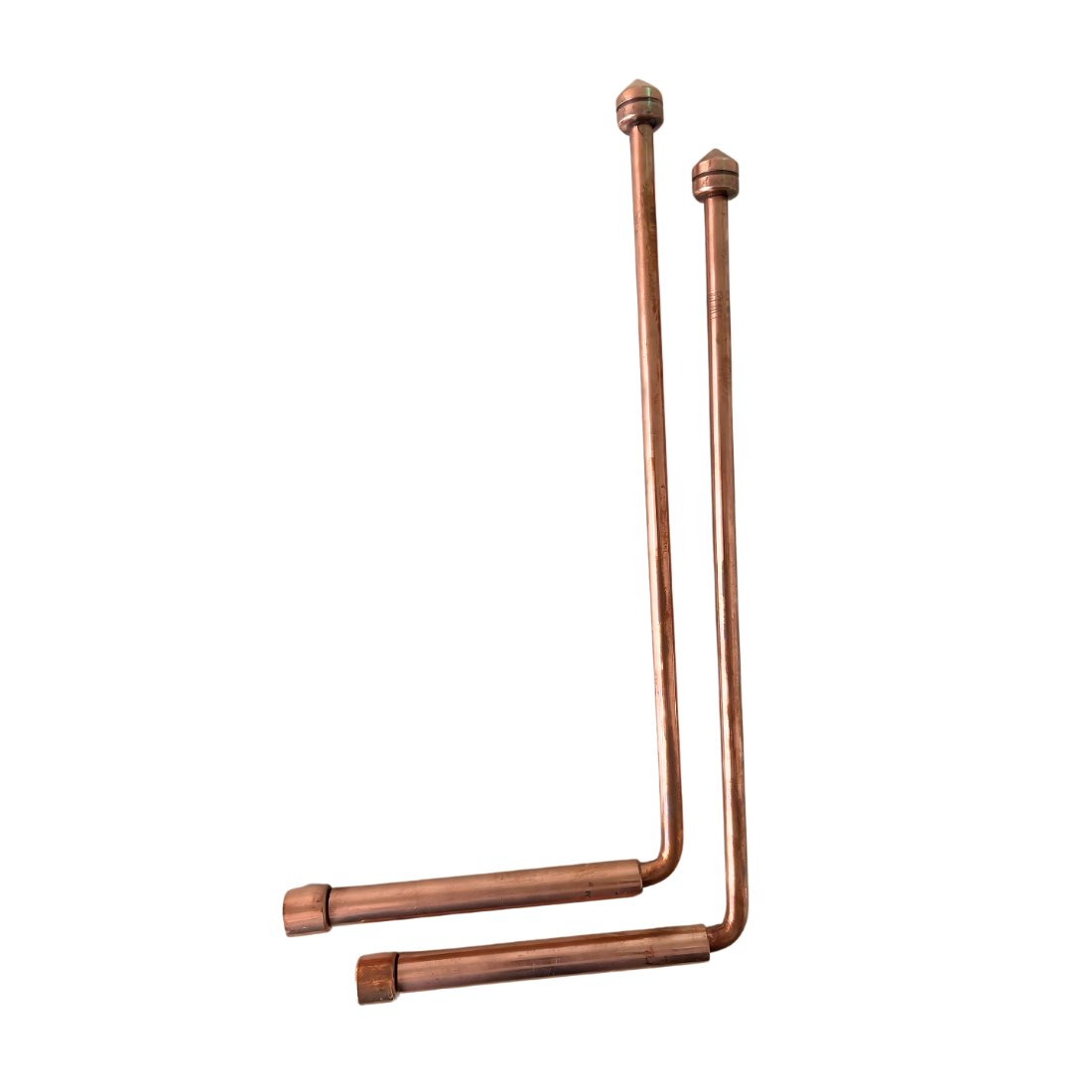 Copper dowsing rods with metal handles arranged diagonally on white