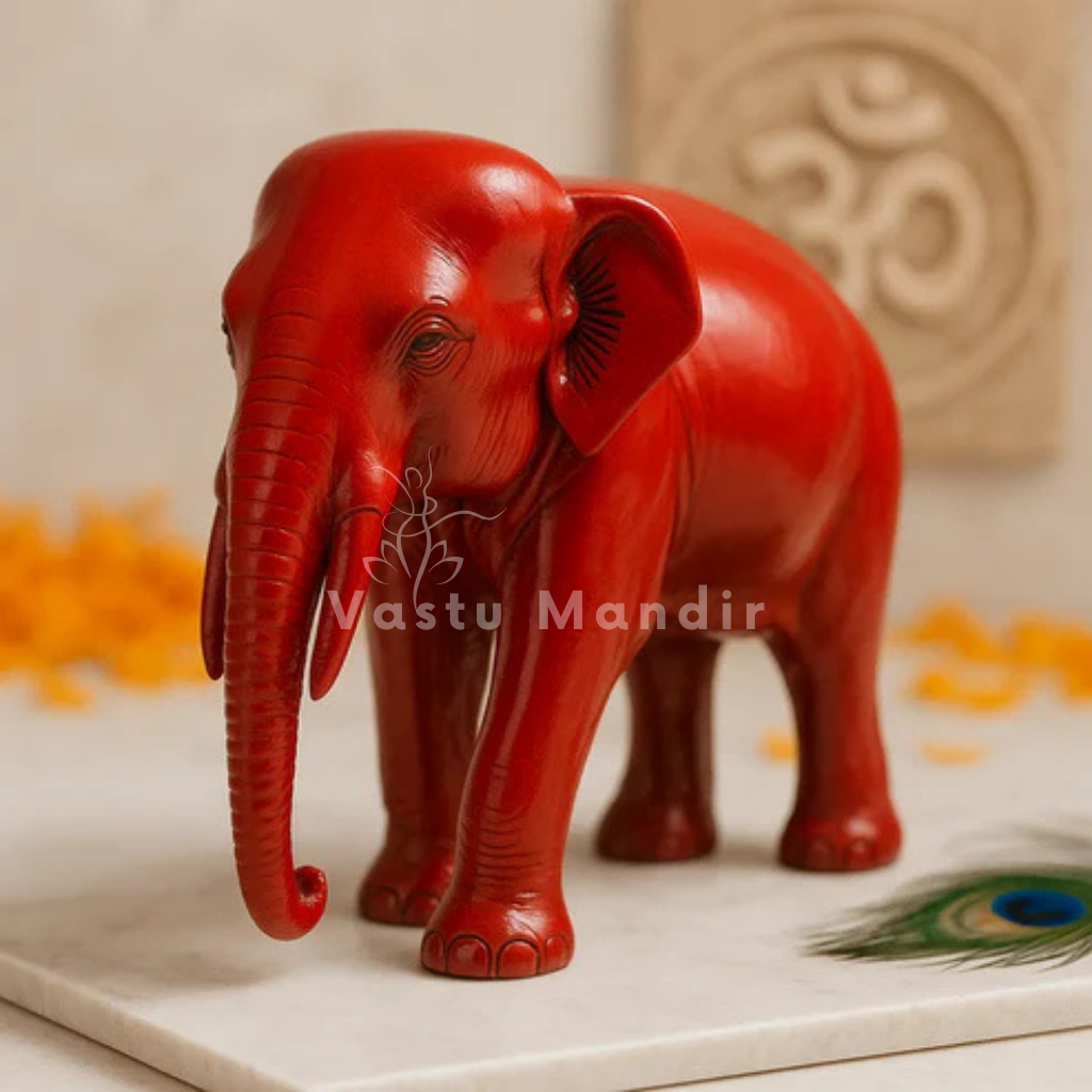 Red-finish elephant idol alternate front angle on a white marble plate