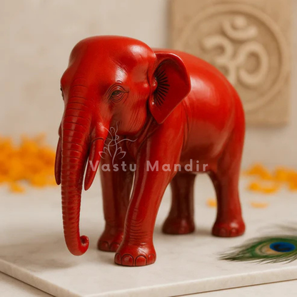 Red-finish elephant idol alternate front angle on a white marble plate