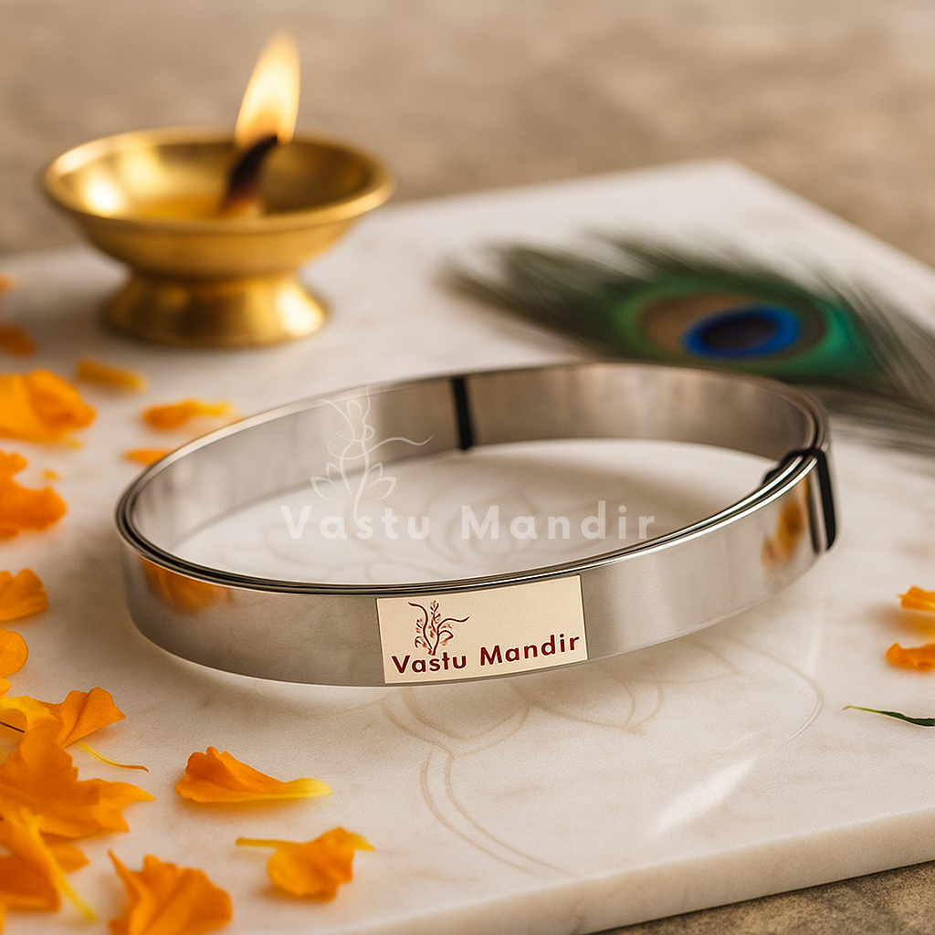 Stainless steel Vastu strip coil on a branded plate with diya and peacock feather