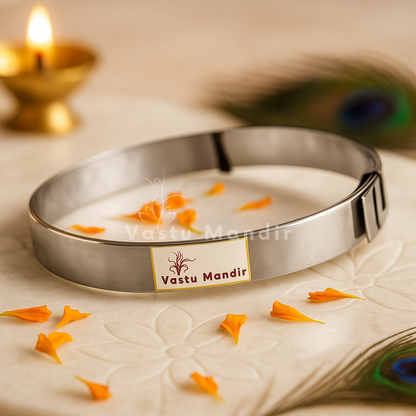 Stainless steel Vastu strip coil with marigold petals, diya and peacock feather