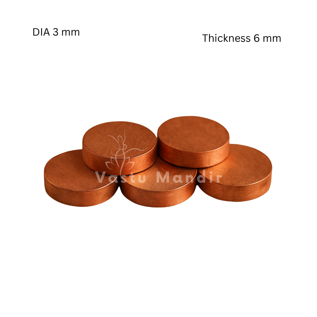 Copper & brass Vastu coins showing its form against a plain white background