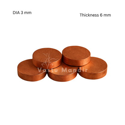 Copper & brass Vastu coins showing its form against a plain white background
