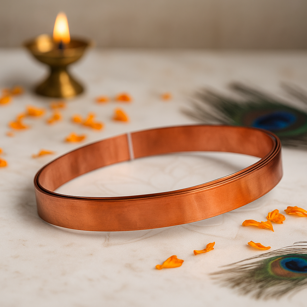 Pure copper Vastu strip coil with marigold petals, diya and peacock feather