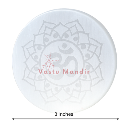 Om symbol selenite plate in a close-up view against a clean white background