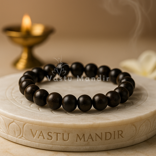 Natural bronzite crystal bracelet shown with a hand in a lifestyle photograph