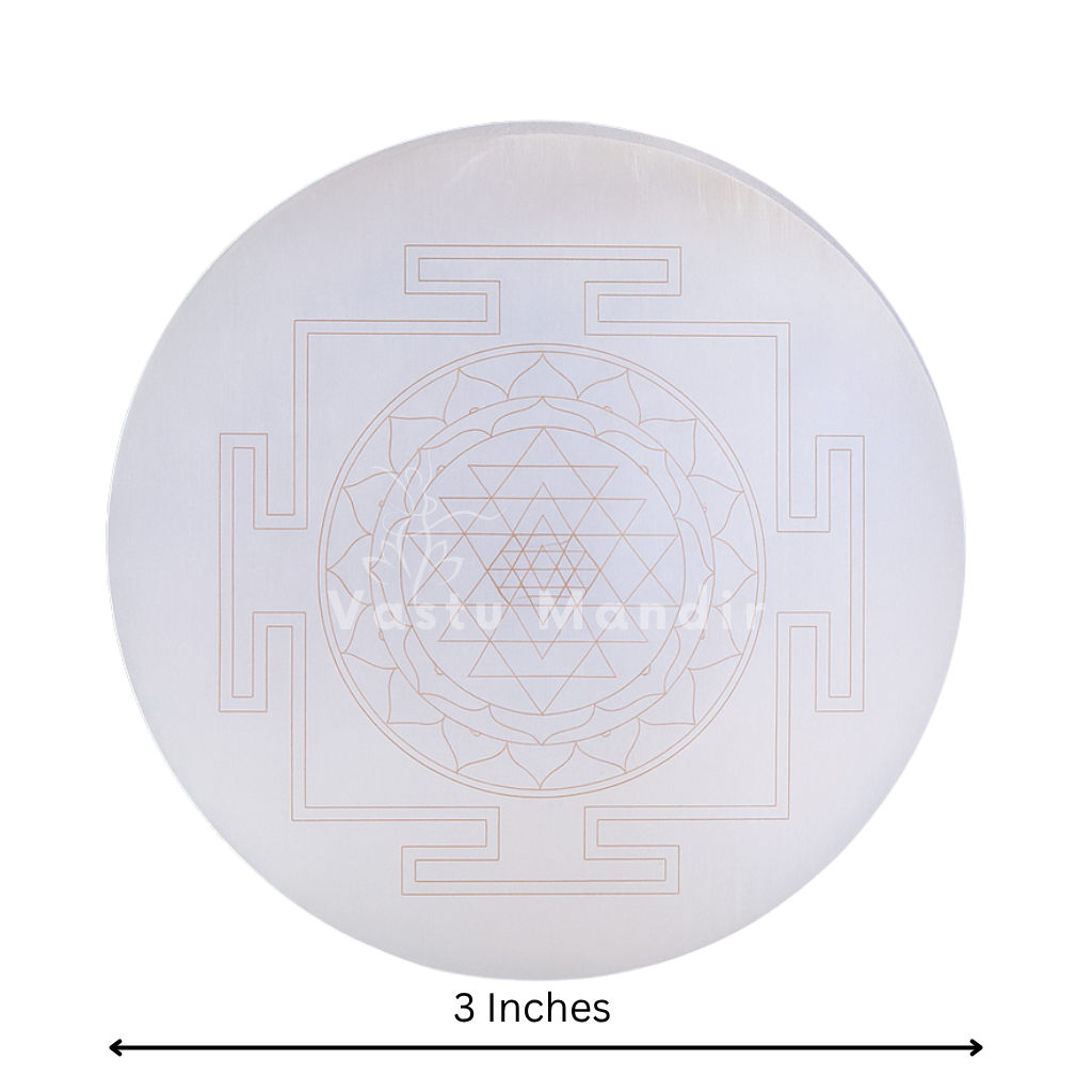 Shree yantra selenite plate on a clean white background