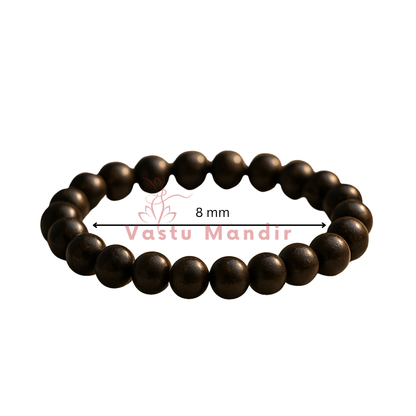 Natural bronzite crystal bracelet showing the bead colour and surface on white