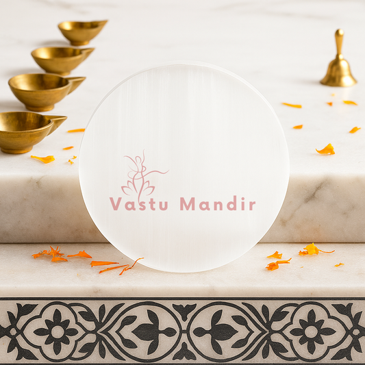 Plain round selenite plate displayed in a softly lit product setting
