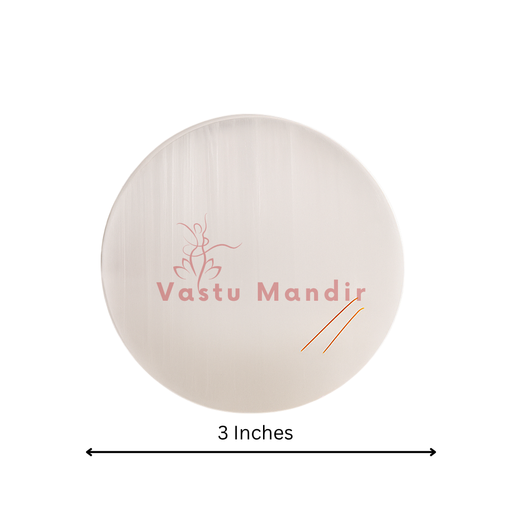Plain round selenite plate showing its form against a plain white background
