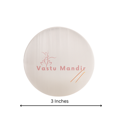 Plain round selenite plate showing its form against a plain white background