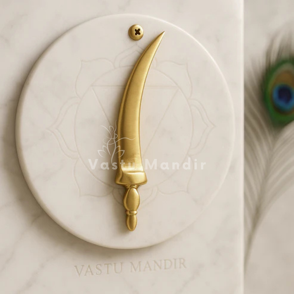 Curved brass talwar miniature alternate front angle on a sacred marble surface