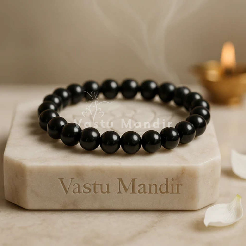Classic black tourmaline crystal bracelet shown in a second hand-held product view