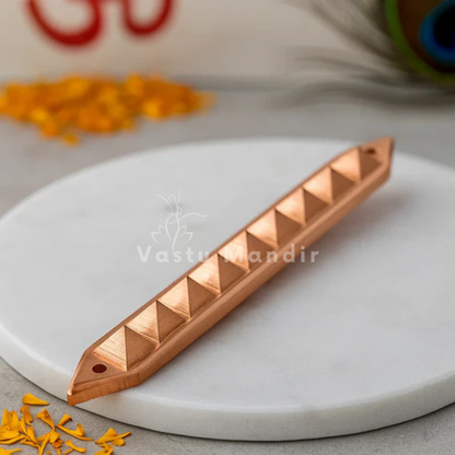 Copper Strip with pyramid pattern on a white plate, branded 'Vastu Mandir'.