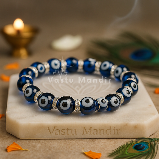 Evil eye crystal bracelet shown with a hand in a lifestyle photograph