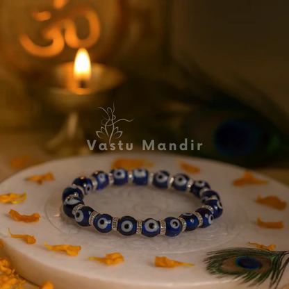 Evil eye crystal bracelet presented with a hand for visual scale