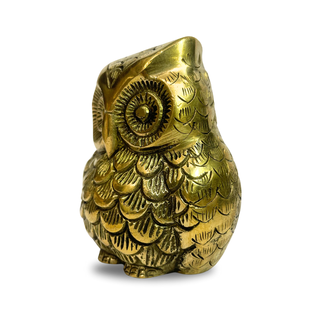 Brass owl idol right-side view isolated on white background