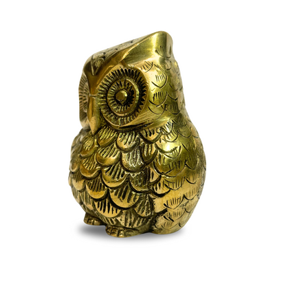 Brass owl idol right-side view isolated on white background
