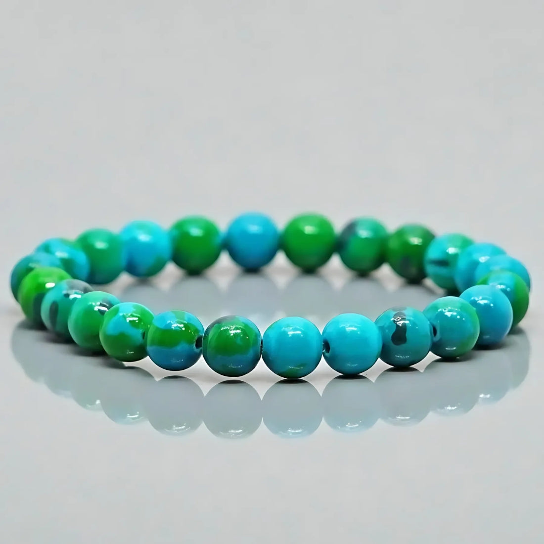 Chrysocolla crystal bracelet arranged in a styled spiritual setting