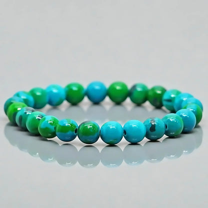 Chrysocolla crystal bracelet arranged in a styled spiritual setting