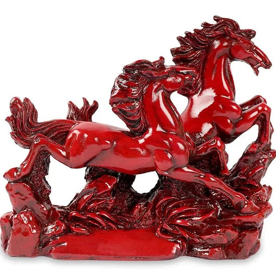 Close view of red running horses resin figurine detailing