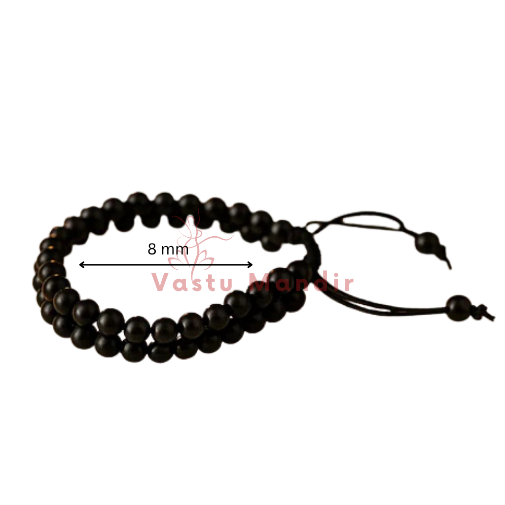 Natural black tourmaline dual strand bracelet showing the bead colour and surface on white