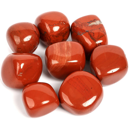 Large polished red jasper stones grouped on a clean white background