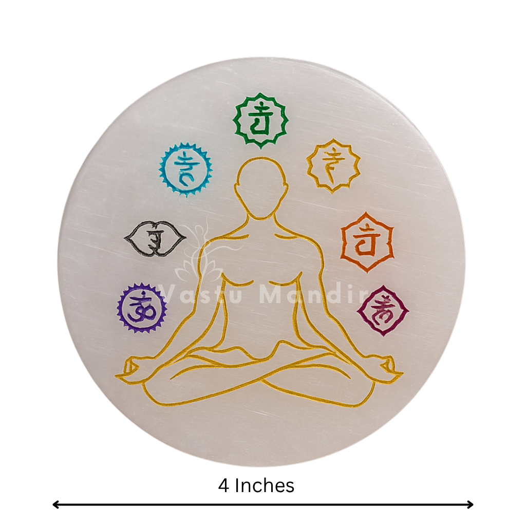 Round 7 chakra selenite plate showing its form against a plain white background