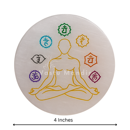 Round 7 chakra selenite plate showing its form against a plain white background