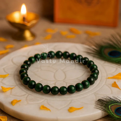 Natural green tiger eye crystal bracelet shown in a second hand-held product view