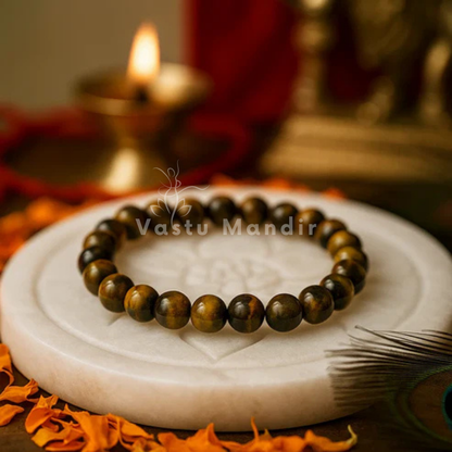 Natural tiger eye crystal bracelet shown with a hand in a lifestyle photograph